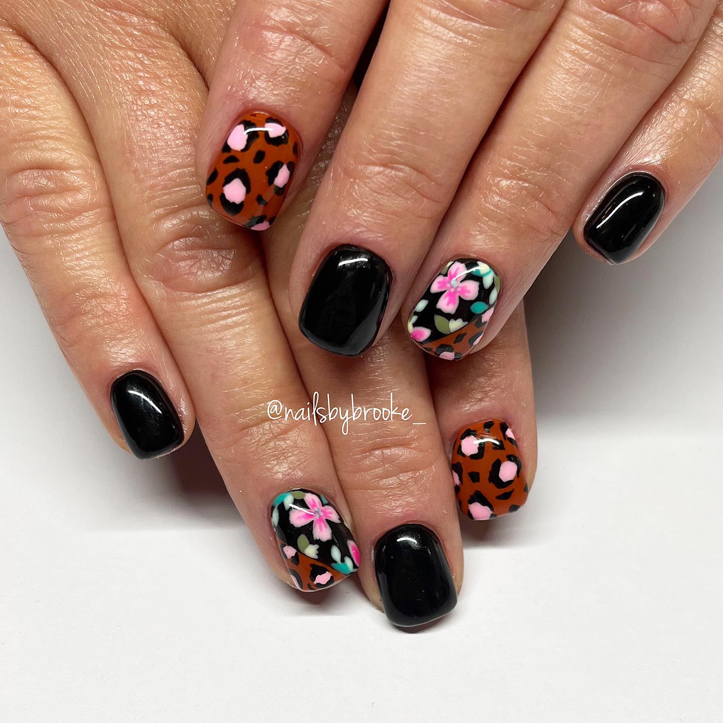 Black Nails With Colorful Floral Patterns