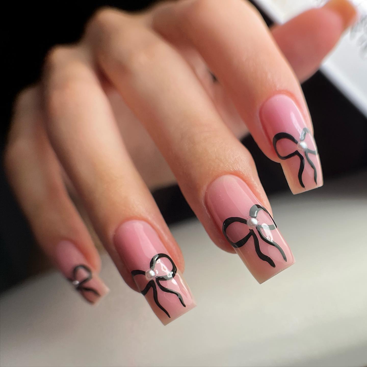 Black Nails With Delicate Feather Motifs