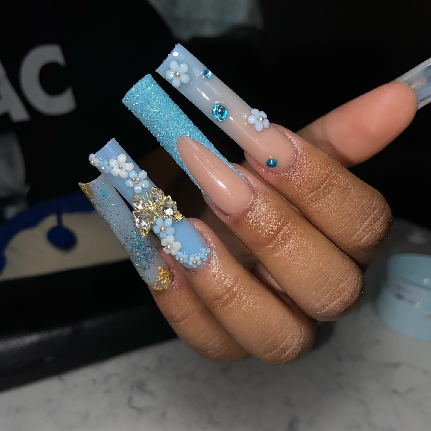 Light Blue Nails With Flowers